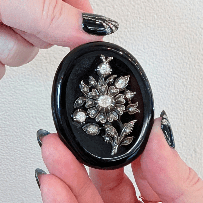 A beautiful antique locket with diamond flowers, seen at Sandy Jacobson Antiques during NYCJAOS.