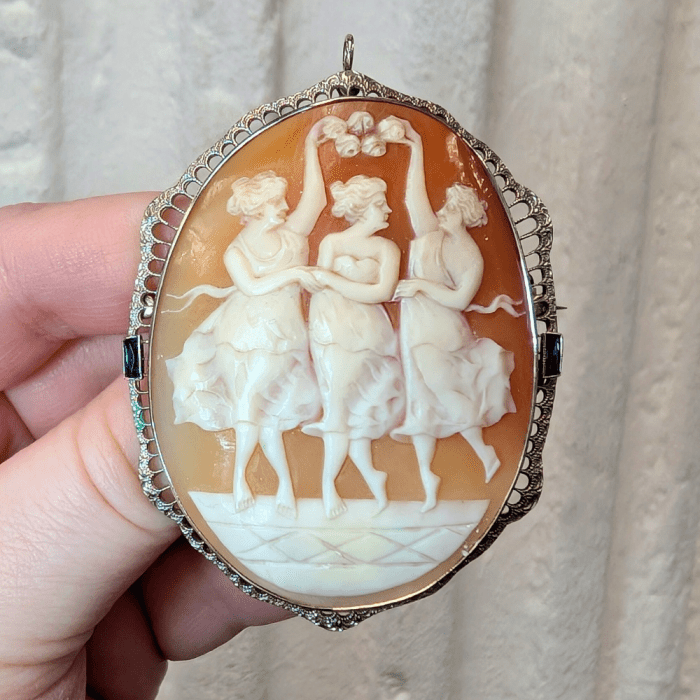 An elegant cameo showing the three graces, from J. Elizabeth Estate Jewelry.