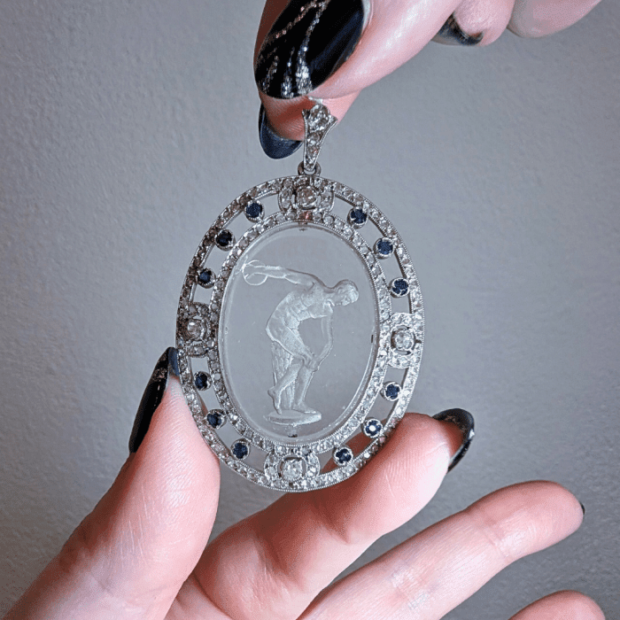 An unusual antique pendant with a carving of a classical figure. Seen at Keyamour during NYCJAOS.