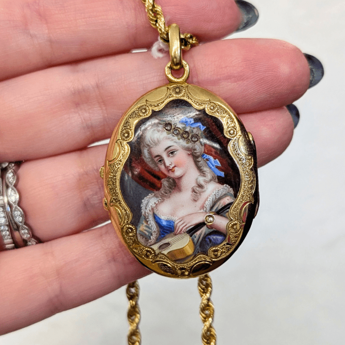 Antique portrait locket with a lady playing a musical instrument. From Pretty Different Shop, at NYCJAOS.