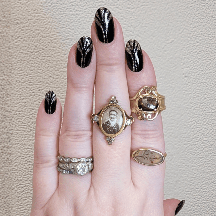 Taste of Honey gold rings with diamonds, dendritic agate, and antique portrait. Spotted at NYCJAOS 2025