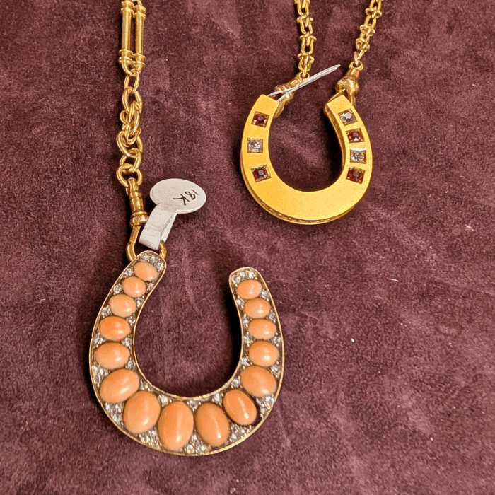 Two antique conversion horseshoe pendants made by PRCNYC. Seen at NYCJAOS.