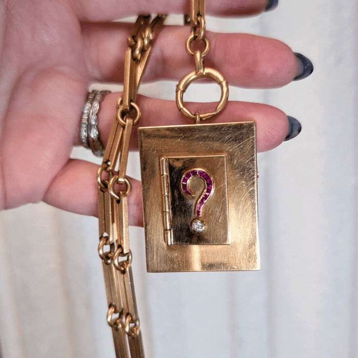 Vintage gold locket with ruby and diamond question mark. Seen at PRCNYC during NYCJAOS
