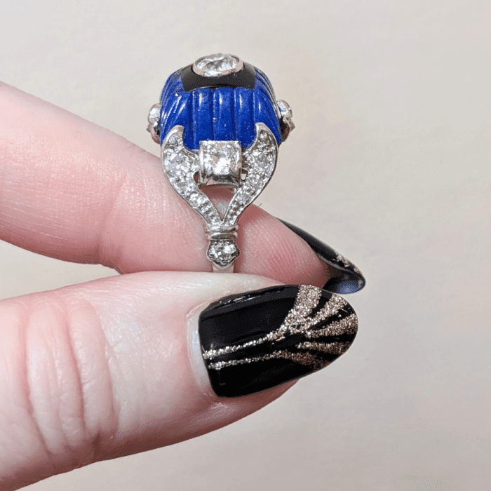 Art Deco diamond ring with carved lapis, onyx, and diamonds, side view. From The Vintage Jeweller.