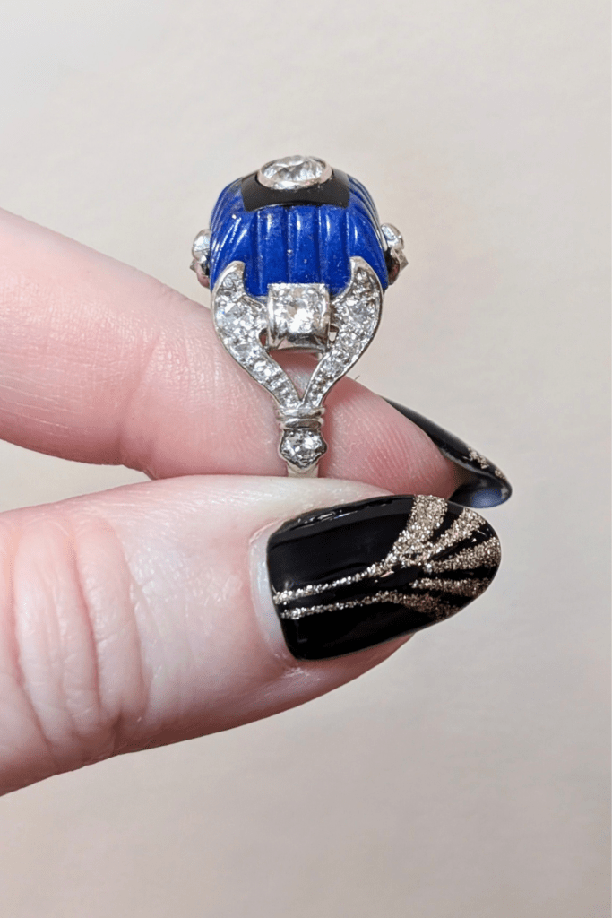 Art Deco diamond ring with carved lapis, onyx, and diamonds, side view. From The Vintage Jeweller.