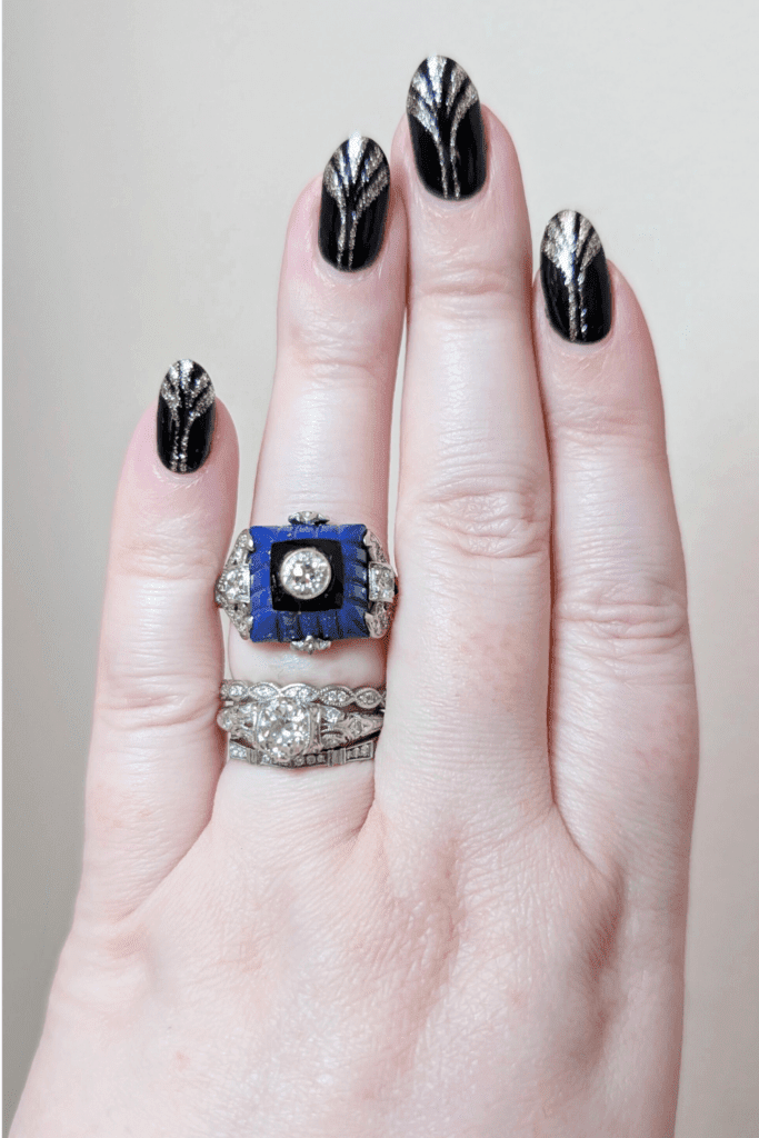 Art Deco diamond ring with carved lapis, onyx, and diamonds. From The Vintage Jeweller.