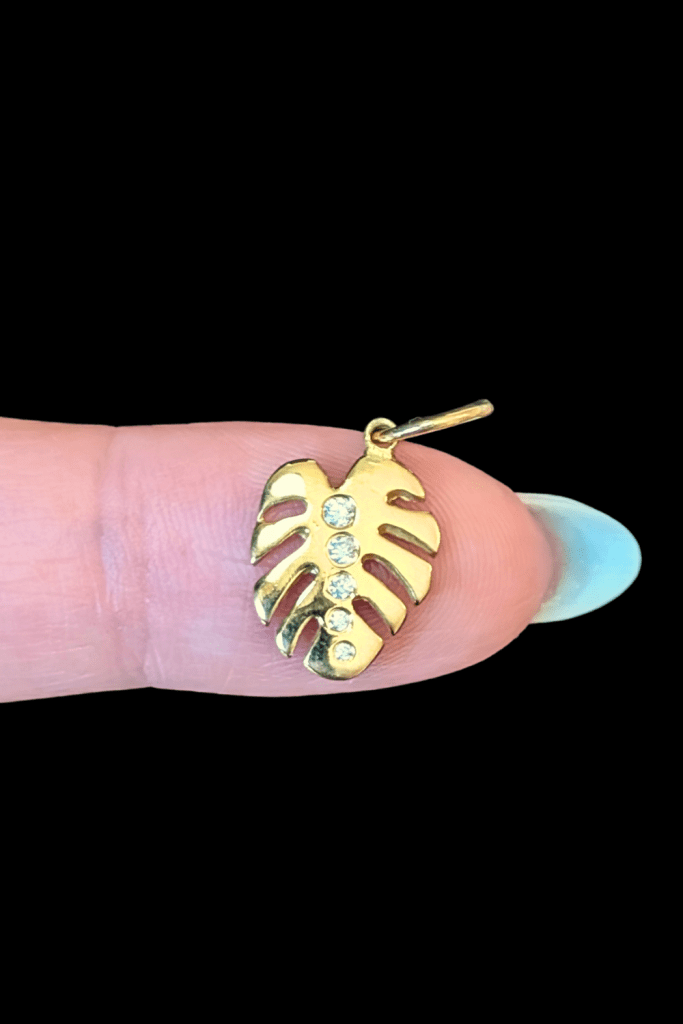 Delphine Leymarie diamond monstera charm in 14K yellow gold from Beaumont Jewelry Collective.