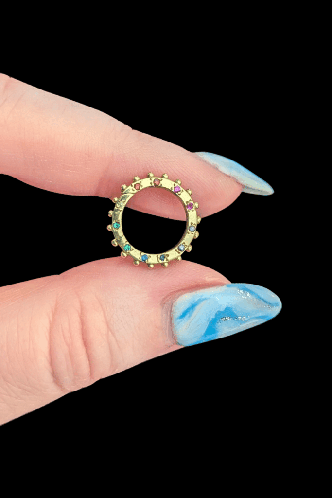 Delphine Leymarie rainbow clicker charm holder connector in 14K yellow gold from Beaumont Jewelry Collective.