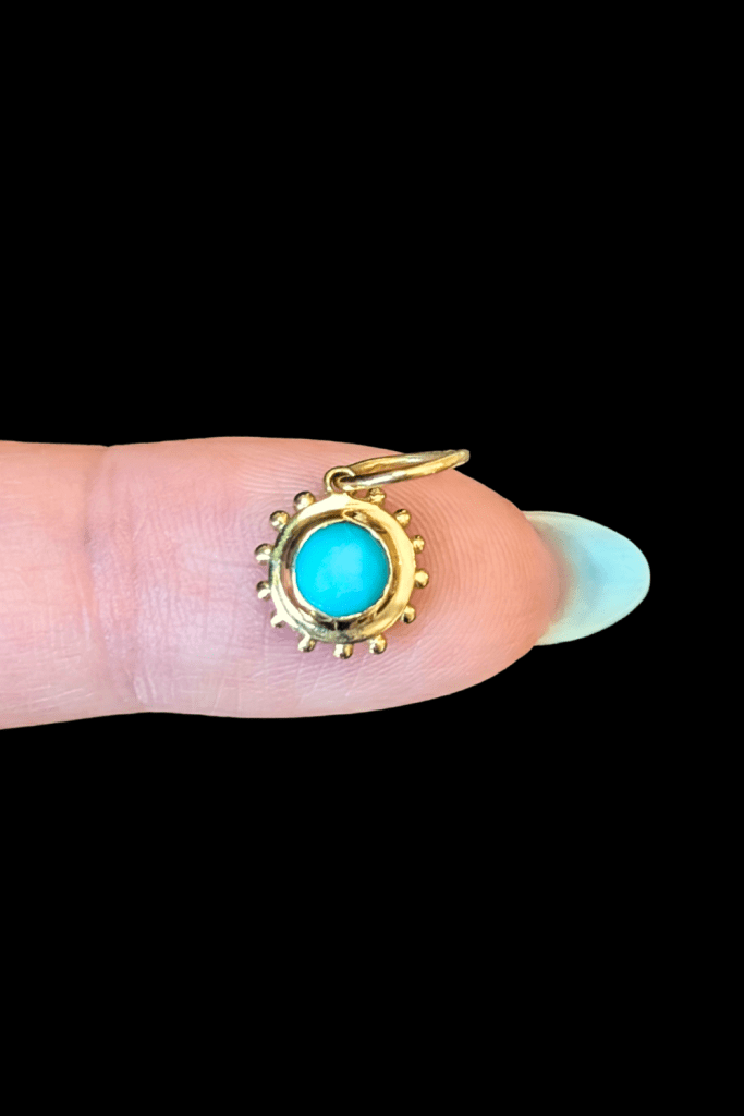 Delphine Leymarie turquoise soleil charm in 14K yellow gold from Beaumont Jewelry Collective
