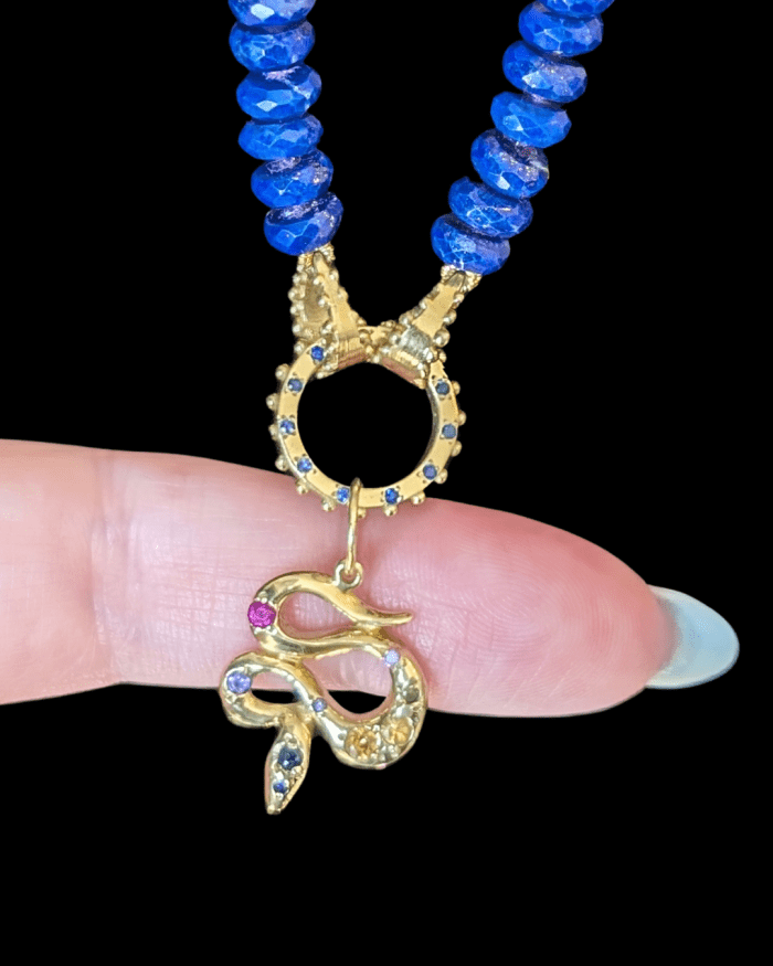 Delphine Leymarie lapis lazuli bead strand with colorful gemstone snake charm from Beaumont Jewelry Collective.