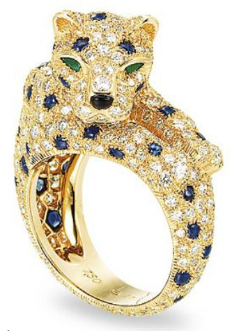 A diamond, sapphire, and emerald panther ring by Cartier. Via Diamonds in the Library.