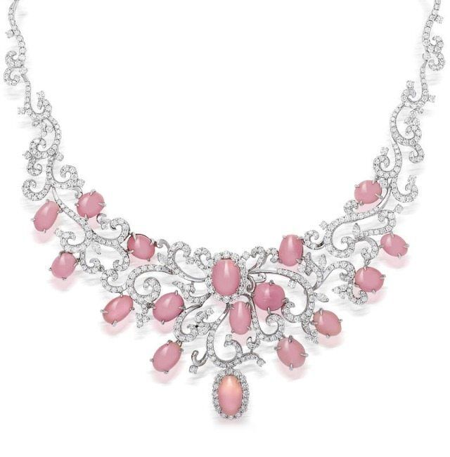 A pink conch pearl and diamond necklace.