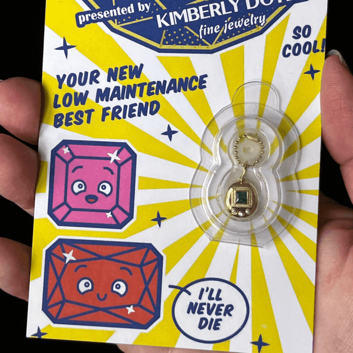 The Gemagotchi charm by Kimberly Doyle Jewelry is the ultimate in 90's nostalgia - Tamagotchi jewelry!