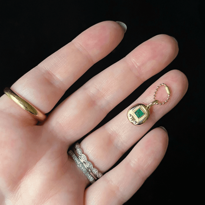 The Kimberly Doyle Gemagotchi charm is inspired by the famous 90's Tamagotchi toy! 90's nostalgia jewelry at its finest.