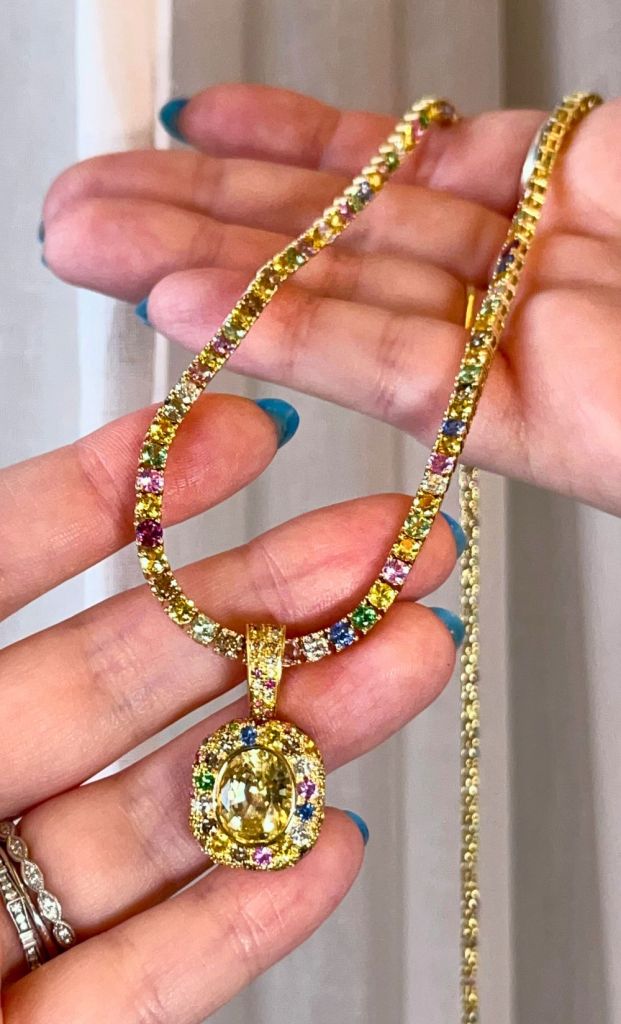 Pastel rainbow necklace with colorful sapphires, garnets, and white diamonds and colored diamonds in gold. By The Crown Collection