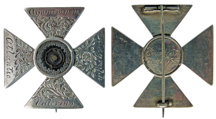 Circa 1858 Maltese cross brooch or medal with slice of the first transatlantic cable, from The Atlantic Cable website.