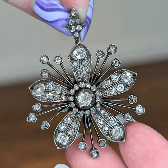 Antique diamond flower pendant brooch from Kitty Verity, seen at NYCJAOS Spring 2025.
