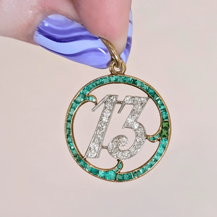 Antique lucky 13 charm in emeralds and diamonds, from Circa 1700.