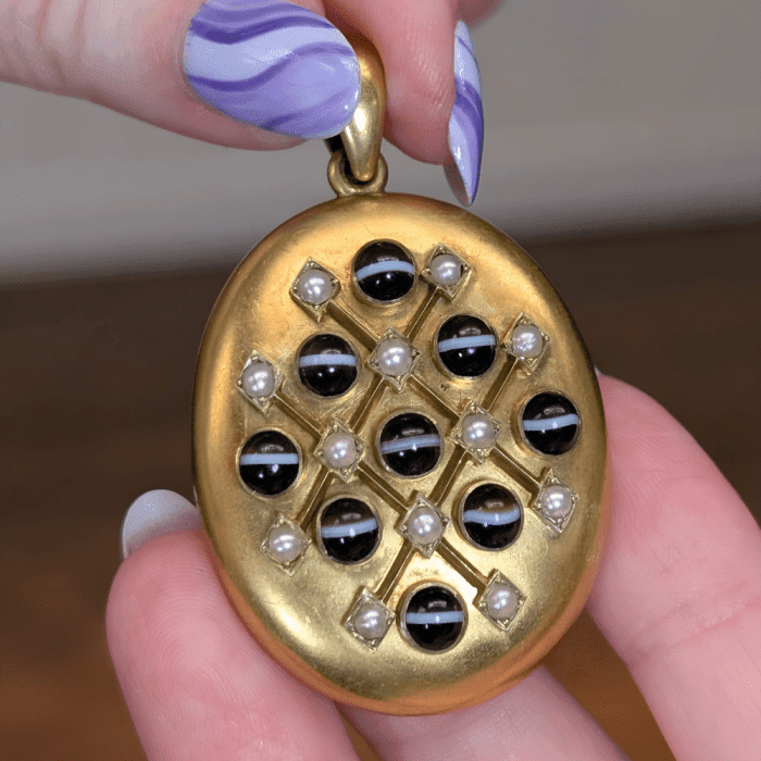 Antique pearl and banded agate locket from Kitty Verity, seen at NYCJAOS Spring 2025.