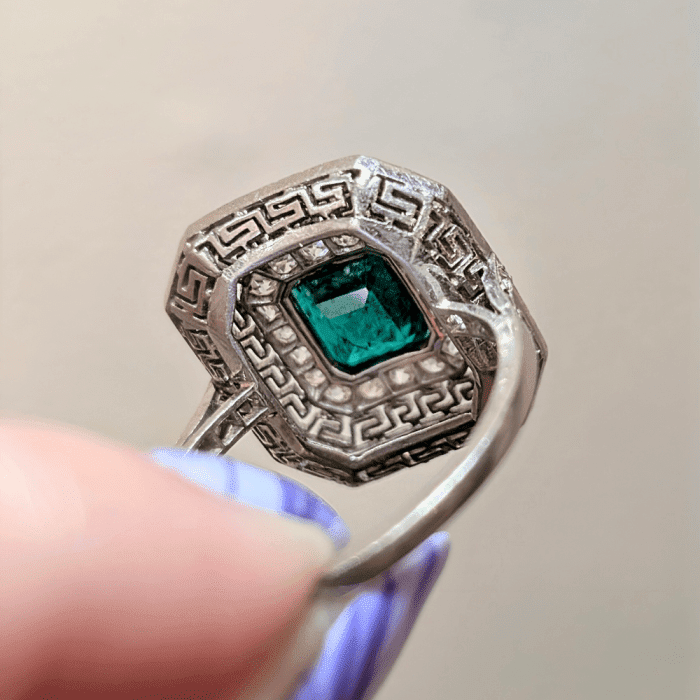 I love the Greek key design on this antique emerald ring from Ishy Antiques; back view. Seen at NYCJAOS Spring 2025.