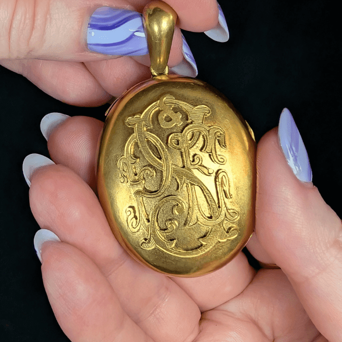 This antique gold monogram locket opens to reveal two painted portrait miniatures of beloved dogs!! Seen at Erica Weiner during NYCJAOS Spring 2025