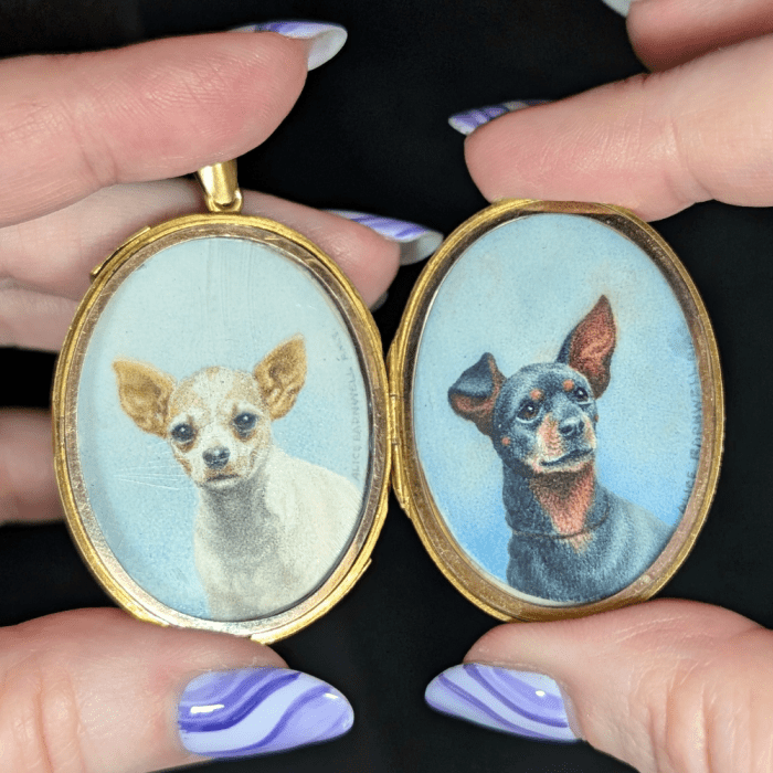 This antique gold monogram locket opens to reveal two painted portrait miniatures of beloved dogs!! Seen at Erica Weiner during NYCJAOS Spring 2025.