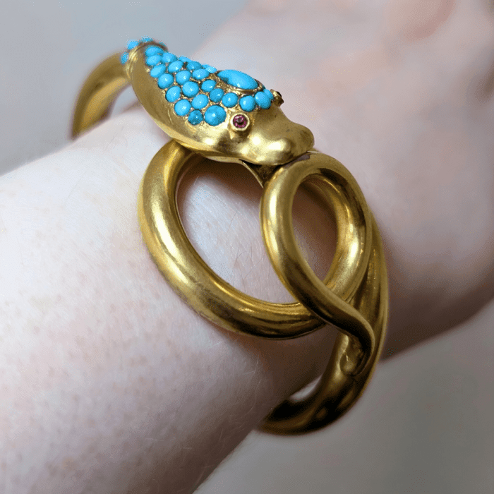 Victorian snake bracelet with turquoise and ruby eyes, on wrist, from Estate Jewelry Mama.