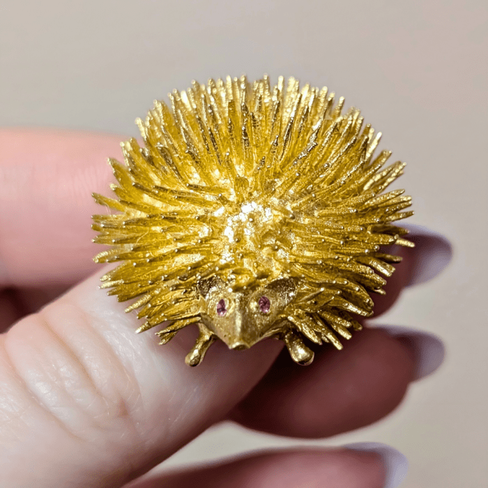 Vintage gold porcupine brooch in gold with ruby eyes, from Estate Jewelry Mama.
