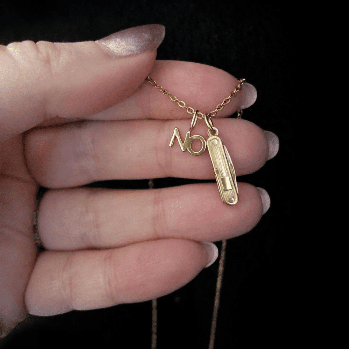 My own daily defiant jewels are this No charm from Automic Gold and a vintage gold switchblade charm.