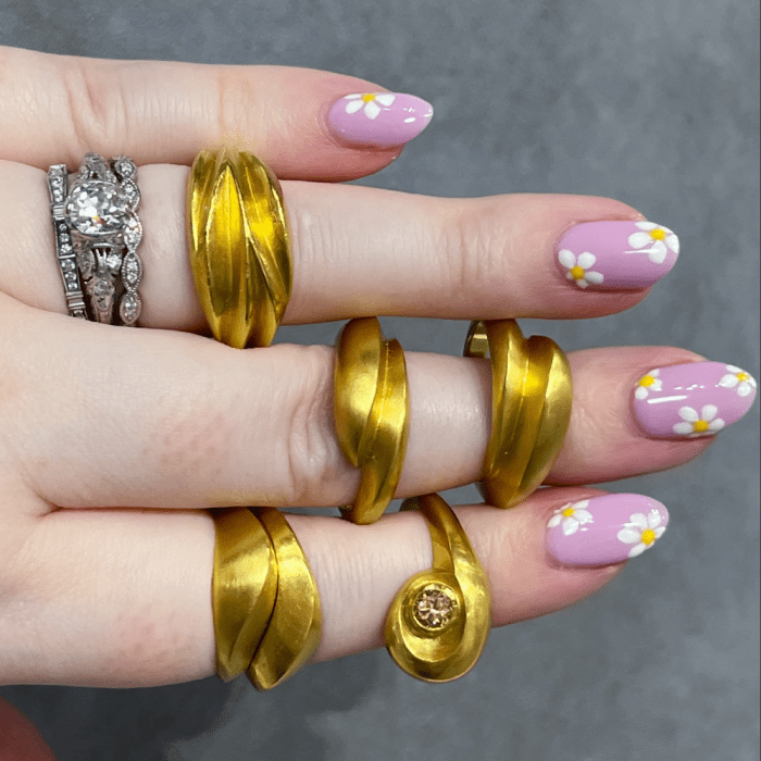 22k yellow gold sculptural rings by i seira jewelry.