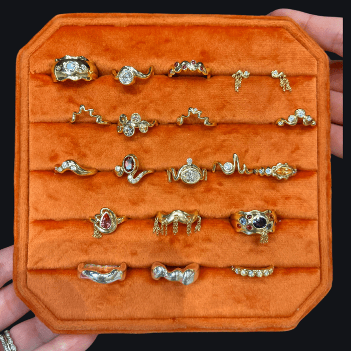 A tray full of gold, gemstone, and diamond abstract rings by Crevette Design Studio.