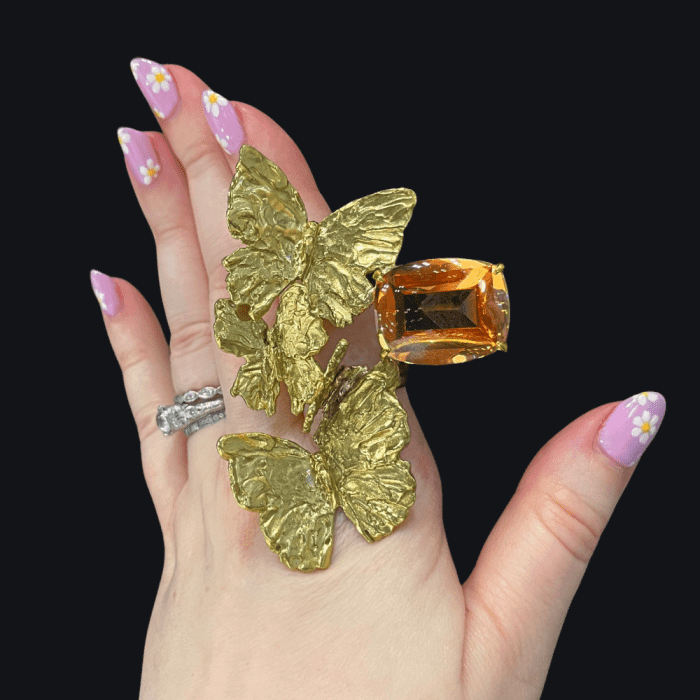 Dorian Webb butterfly floating ring with mystic quartz.