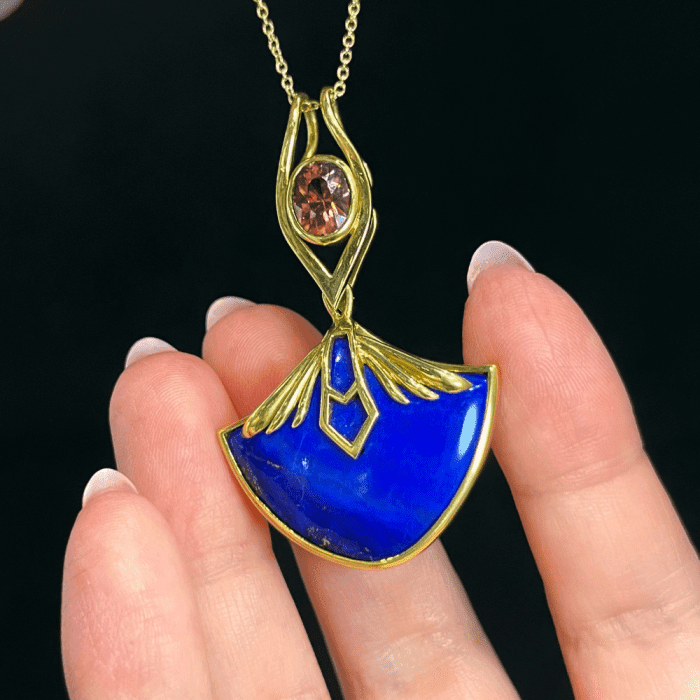 Mercurius Jewelry reversible necklace with peachy Zicon and Lapis in Faimined gold.