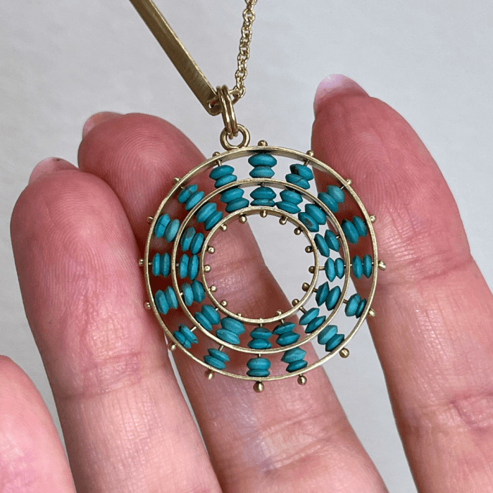 Turquoise pendant necklace in gold by Hilary Finck Jewelry. One of the emerging jewelry designers at CURATED at Luxury Lifestyle