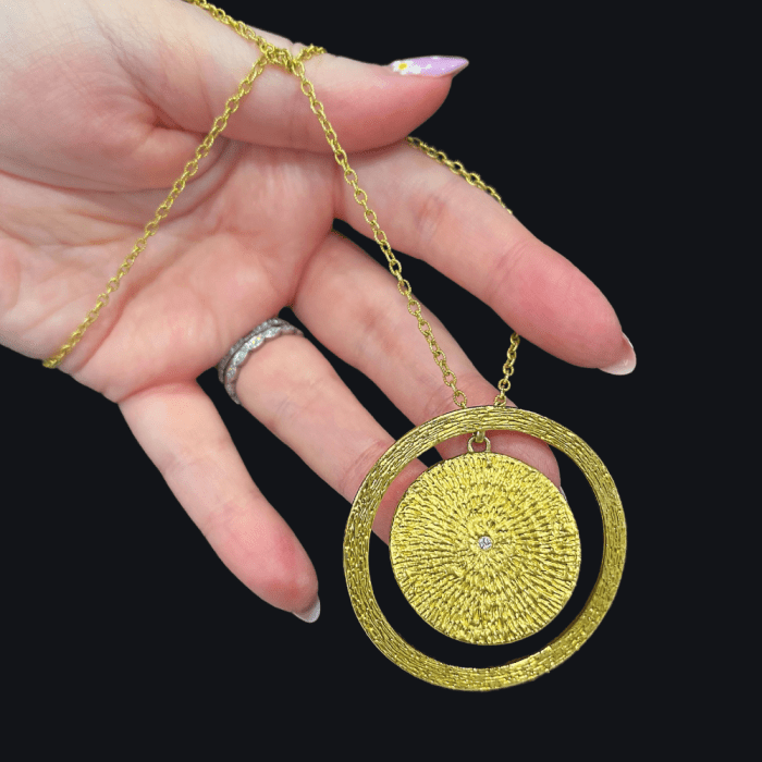 Two textured gold pendants by Sunlit Fine Jewelry