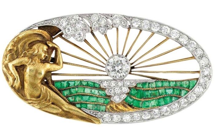 Art Nouveau sunrise brooch with diamonds and emeralds. Via Diamonds in the Library.