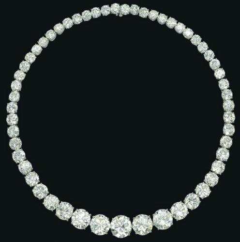 Magnificent diamond rivere necklace set with fifty-five graduated brilliant-cut diamonds, weighing approximately 117.31 carats in total, and mounted in platinum. Via Diamonds in the Library.