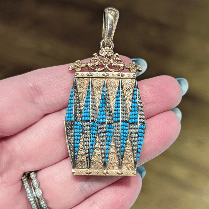 A very cool antique turquoise and pearl gold locket from Maryanntiques, seen at NYCJAOS Spring 2026