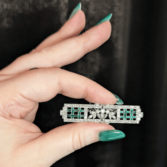 Exquisite emerald and diamond floral brooch by J.E. Caldwell, seen at Lauren DeYoung during NYCJAOS Spring 2026.