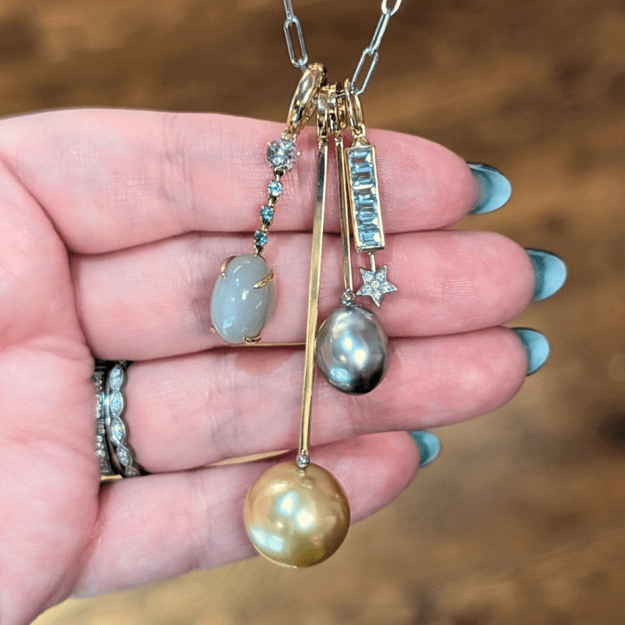 Unhada and Lauren Chisholm pearl and gemstone charms. Seen at NYCJAOS 2026