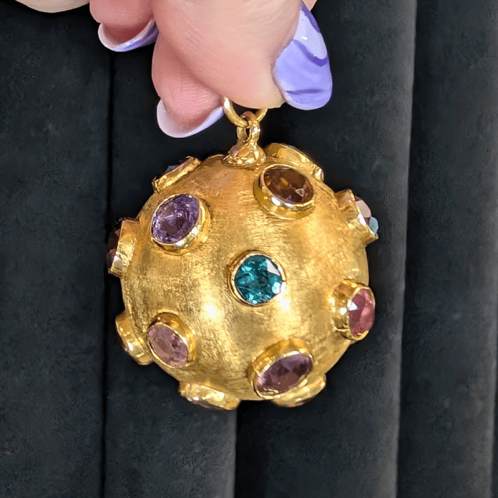 A large, magnificent vintage Sputnik pendant in gold with colored gems, from 3 Graces of Gold, seen at NYCJAOS Spring 2025.