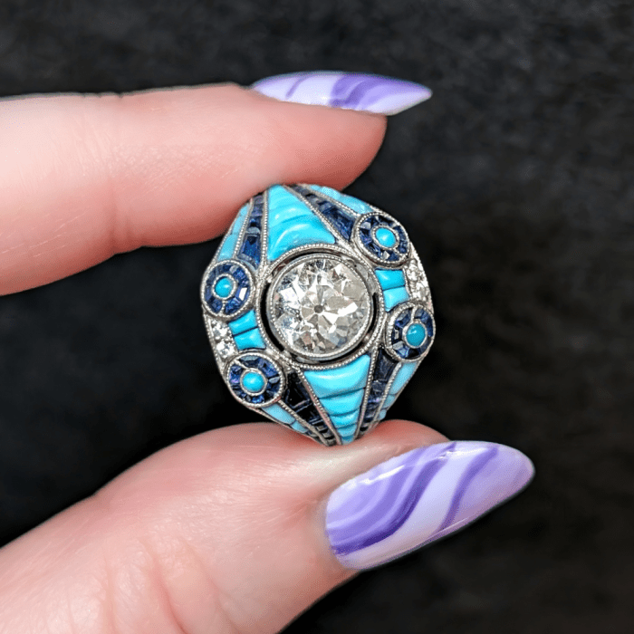 A magnificent Art Deco turquoise ring with sapphires and diamonds. From Antique Jewelry Box, seen at NYCJAOS Spring 2025.
